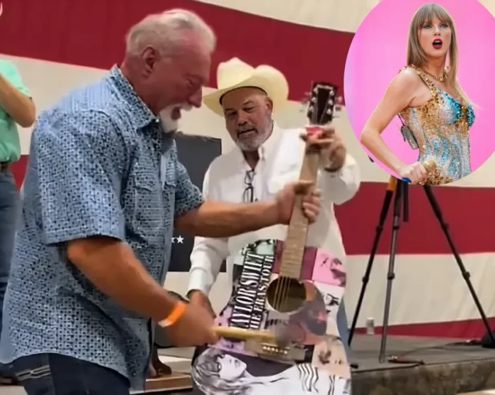 elderly man smashes Taylor Swift signed guitar