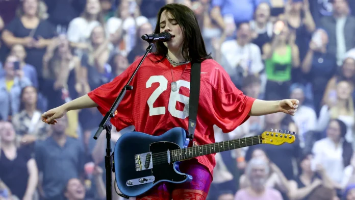 Billie Eilish urges fans to vote mid-concert